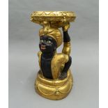 A resin Blackamoor stool. 55 cm high.