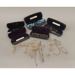 A collection of vintage spectacles, some cased.