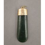 A 15 ct gold mounted jade pendant. 4.5 cm high.