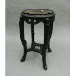 A Chinese urn stand. 59 cm high.