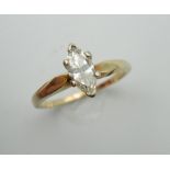 A 14 K gold marquise cut diamond solitaire ring. Ring Size M.