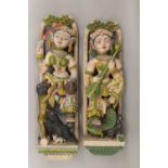 A pair of Indian painted figural carvings. The largest 72 cm high.