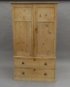 A Victorian pine linen press, lacking shelves. 106 cm wide.