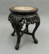 A Chinese marble topped stand. 49 cm high.