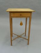 A Victorian pine single drawer side table. 48 cm wide.