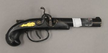 A novelty cigarette lighter formed as a pistol. 19 cm long.