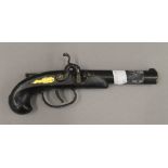 A novelty cigarette lighter formed as a pistol. 19 cm long.