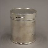 A silver cylindrical box. 8.5 cm high. 112.6 grammes.