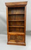 A large modern hardwood bookcase with cupboard base. 205 cm high x 100 cm wide.