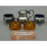 A hammered pewter three-piece condiment set with original blue glass liners