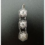 An Art Deco platinum diamond three section pendant. 3.5 cm high.