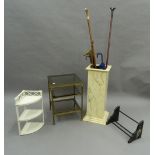 A simulated marble stick stand with walking sticks, a glass etergere, a bookrack and a corner shelf.