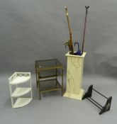 A simulated marble stick stand with walking sticks, a glass etergere, a bookrack and a corner shelf.