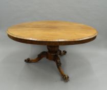 A Victorian rosewood loo table. 150 cm long.