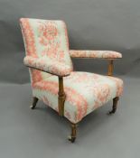 A Victorian upholstered open armchair. 66 cm wide.