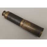 A Victorian four drawer brass telescope, with leather grip. 113 cm long extended.