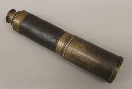 A Victorian four drawer brass telescope, with leather grip. 113 cm long extended.