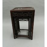 A Chinese nest of three tables. 38 cm wide.
