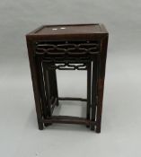 A Chinese nest of three tables. 38 cm wide.
