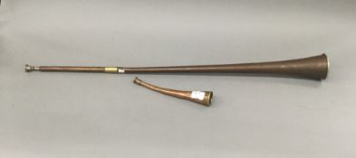 An antique copper and brass coach horn with 19th century mouthpiece,