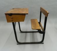 An early 20th century school desk. 61 cm wide.