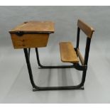 An early 20th century school desk. 61 cm wide.