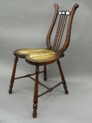 A Victorian lyre back music chair. 35.5 cm wide.