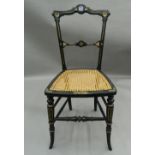 A single gilded cane seated chair inset with a classical Jasperware roundel. 38 cm wide.