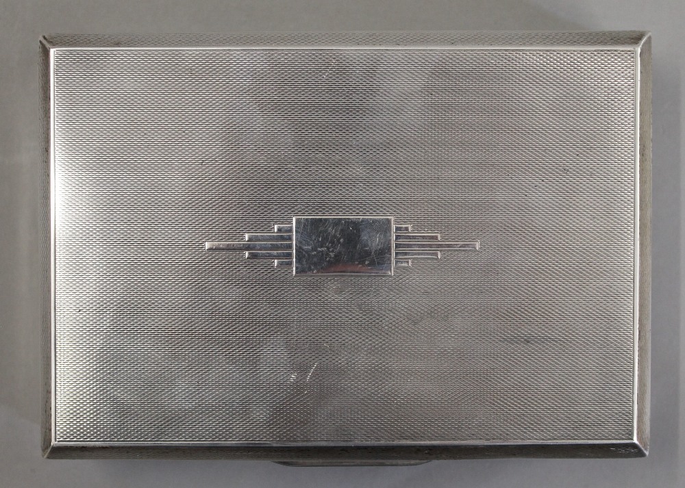 An Art Deco silver cigarette box. 16.5 cm wide. 22.2 troy ounces total weight. - Image 6 of 6