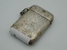 An unmarked white metal vesta case. 4 cm high.