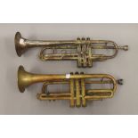 Two brass trumpets. The largest 53 cm long.