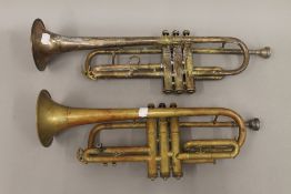 Two brass trumpets. The largest 53 cm long.
