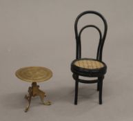 A doll's house tripod table and a chair. The former 4 cm high.