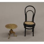 A doll's house tripod table and a chair. The former 4 cm high.