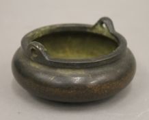A Chinese bronze censer. 11.5 cm diameter.