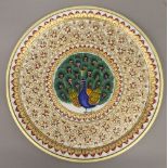 A boxed Indian gold leaf embellished marble plaque. 30 cm diameter.