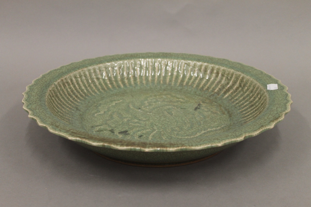 A large Chinese celadon dish. 41.5 cm diameter.