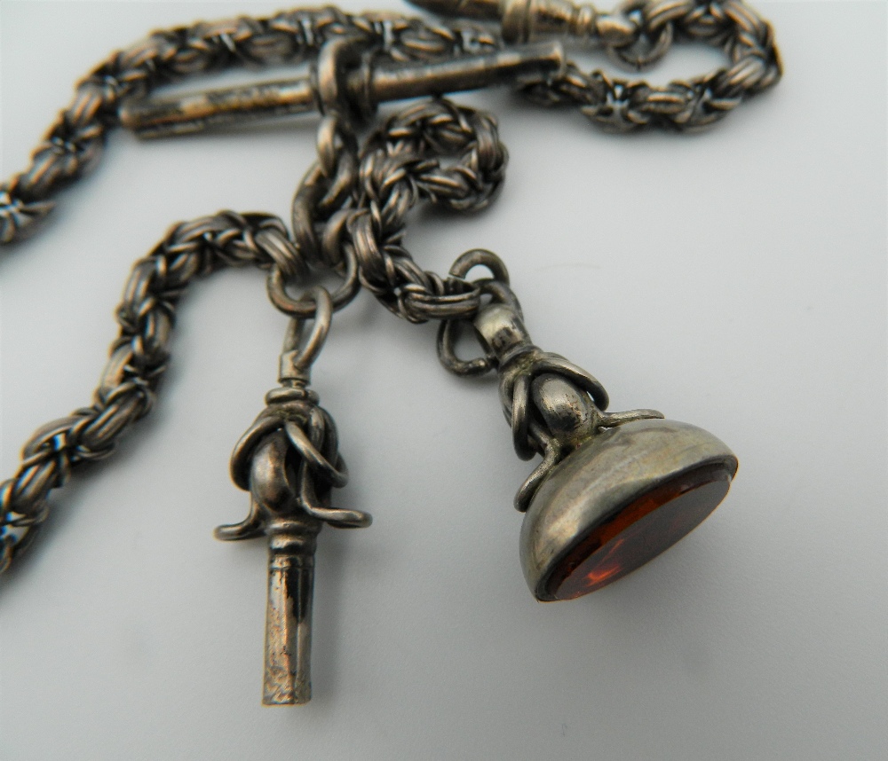 An unmarked silver watch chain, together with key and fob. 34 cm long. - Image 2 of 3