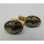 A pair of silver and enamel cufflinks, bearing Russian marks.