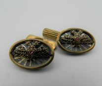 A pair of silver and enamel cufflinks, bearing Russian marks.