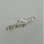 An 18 ct white gold nine stone diamond ring. Ring size P.