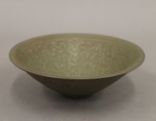 A Chinese crackle glazed green floral bowl. 20 cm wide.