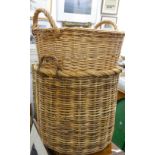 Two large log baskets. The largest 55 cm wide.