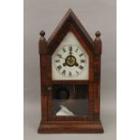 A rosewood mantle clock. 39.5 cm high.