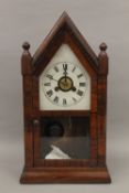 A rosewood mantle clock. 39.5 cm high.