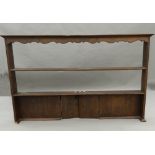 An oak dresser rack. 164.5 cm wide.