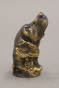 A brass vesta formed as a dog's head. 5.5 cm long.