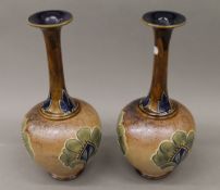 A pair of Art Nouveau Royal Doulton vases. 40 cm high.