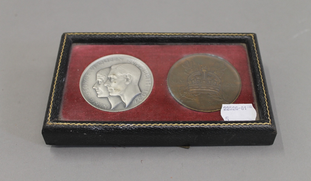 A leather cased pair of King George VI and Queen Elizabeth coronation medallions