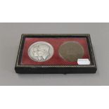 A leather cased pair of King George VI and Queen Elizabeth coronation medallions